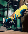 Worker using Heavy Duty Latex Palm Coated Safety Gloves With Kevlar Liner For Cut Resistance A3, operating machinery