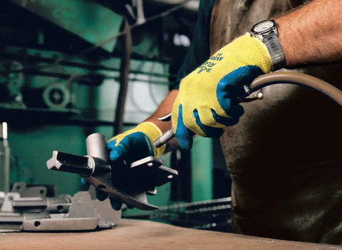 Worker using Heavy Duty Latex Palm Coated Safety Gloves With Kevlar Liner For Cut Resistance A3, operating machinery