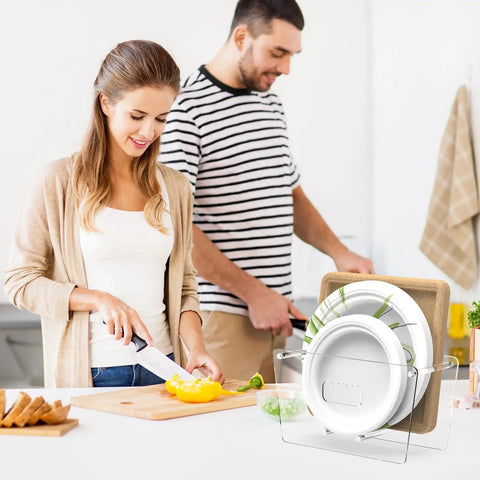 Space Saving Acrylic Paper Plate Dispenser For 5 To 12 Inch Plates shown on kitchen countertop with two people cooking