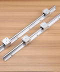 Real Deal SBR12 Linear Rail Shaft Set Built Tough With Four Matching Bushings Featuring Pre Drilled Mounting Holes For CNC Routers 3D Printers And Robotics Projects, showing two steel shafts with matching bearing blocks.