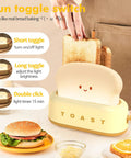 Toaster Shaped LED Table Lamp With Rechargeable Battery Nightstand light showing toggle switch settings near a breakfast scene