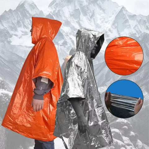 4 Pack Emergency Ponchos With Reversible Orange And Reflective Silver Hooded Heat Retention Mylar, Windproof Rain Gear shown outdoors