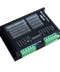 CNC digital stepper driver DM556 module with black housing and green terminal blocks.