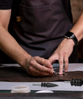 Craftsman using Hella Smooth Rotary Leather Burnisher Bits Set With Multi Groove Polishing Heads for edge shaping on leather.