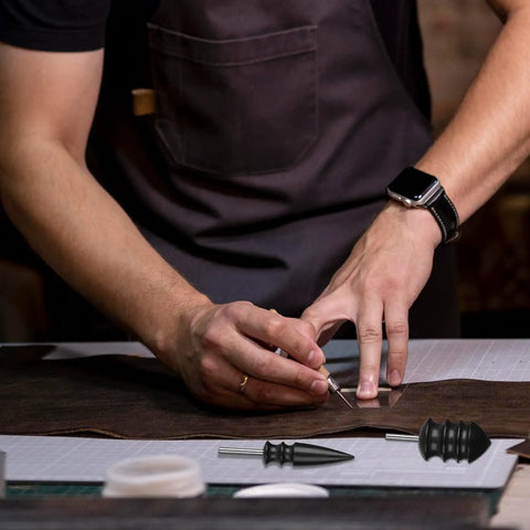 Craftsman using Hella Smooth Rotary Leather Burnisher Bits Set With Multi Groove Polishing Heads for edge shaping on leather.