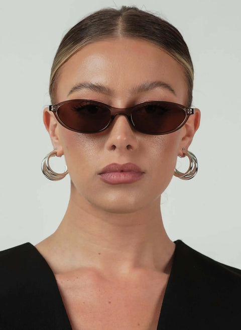 Woman wearing Retro Oval Sunglasses For Women With Cat Eye 90s Vibe Lightweight Narrow Frames UV Protection Sun Glasses