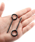 Hand holding two pieces from 12 Piece Hex Dogging Key Set With Full Loop For Key Ring, black durable steel hex keys