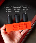 Tap Socket Wrench Three Piece Adapter Set For Quick Threading Snug Secure Durable black metal sockets in orange holder