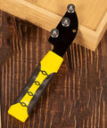 High Performance Copper Wire Straightener With Comfort Handle, black and yellow tool on wooden surface for efficient wiring tasks.