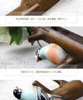 Realistic decorative bird figurines perched on a wooden branch, enhancing home decor with natural elegance.