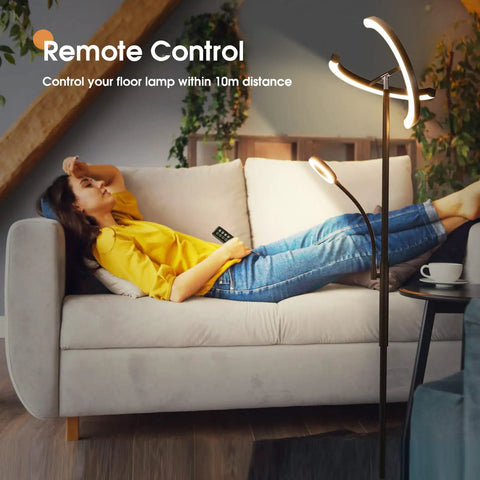 Person relaxing with Two In One Smart Remote And Touch Control LED Floor Lamp With Reading Light, rotatable torchiere style