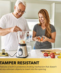 Couple using blender beside 20A Tamper-Resistant Receptacle Floor Box With Flip Lid And Brass Cover in kitchen countertop.