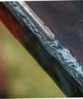 Close-up of Low Temp Aluminum Welding Rods Set 6 Pack Multipurpose Welding Sticks for Easy Use with metal surface