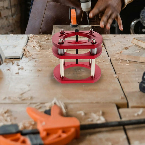 Sturdy Iron Router Lift Table Base With Red Finish For Small Electric Tenoning And Trimming Machines on wooden workspace.