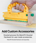 GRR-RIPPER 2GO push block in yellow with green accents, held in hand for routers and table saws