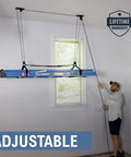 Man using Garage Ceiling Pulley System 2 Pack For Kayaks And Canoes, Heavy Duty Overhead Storage Lift Holds Up To 150 Lbs, 2 To 1 Mechanical Advantage, Ideal For Ladders, Paddleboards, Rooftop Boxes to hang ladder