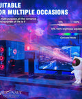 Desk with Cosmic Projector Lamp With LED Night Light For Kids, Spaceman Starry Sky Night Projector beside gaming setup.