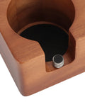Close-up of Solid Built 58mm Wooden Coffee Tamper Station showcasing portafilter holder and non-slip pad detail.