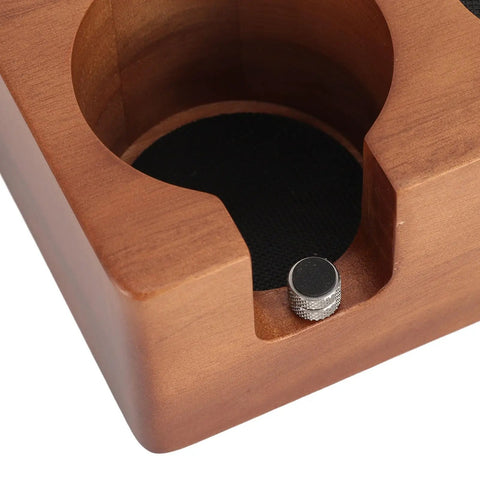 Close-up of Solid Built 58mm Wooden Coffee Tamper Station showcasing portafilter holder and non-slip pad detail.