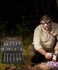 Heavy Duty 88 Slot Knife Display Case For 64 Plus Pocket Knives in grey, shown in an outdoor camping setting