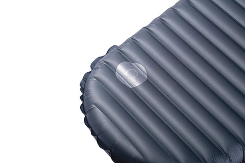 Close-up of a camping mattress with a patch from the Instant Field Camping Mattress Repair Kit With Glue Dots Patches And Alcohol Prep Pads