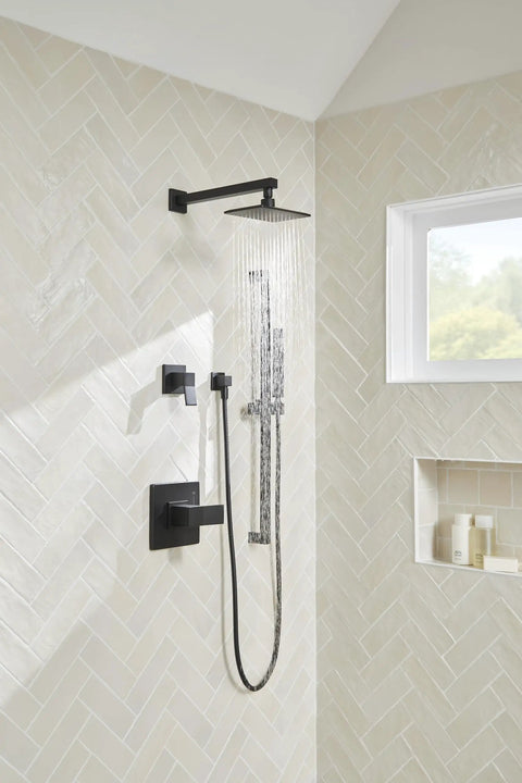 Avian 1-Handle Wall Mount Valve Trim Kit in Satin Black with Treysta Cartridge, installed in modern shower space.