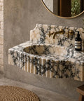 Straight Up Solid Hand Carved Arabescato Marble Wall Mount Sink With Polished Fluted Stone Vanity Basin in a minimalist bathroom