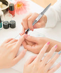 Dual Ended Hard Gel Nail Brush For Builder Gel And Polygel used for nail art, professional brush with rhinestone handle in use at salon.