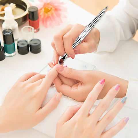 Dual Ended Hard Gel Nail Brush For Builder Gel And Polygel used for nail art, professional brush with rhinestone handle in use at salon.