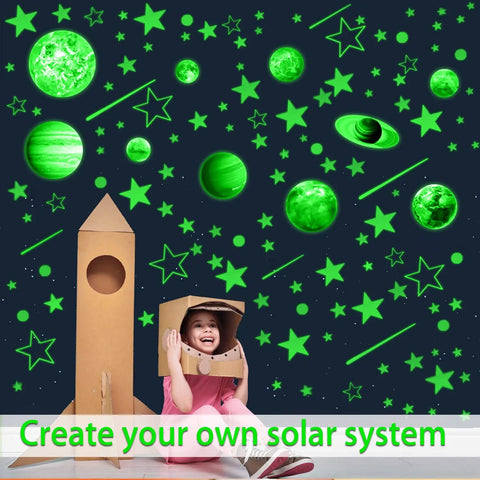 Child with cardboard rocket under Glow In The Dark Stars And Planets Ceiling Decals For Bedroom And Living Room Space Wall Stickers