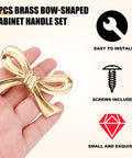 Hand holding brass bow-shaped cabinet knob with text highlighting easy install and screws included. Bow Shape Cabinet Knobs Set Of 6 Brass Vintage Gold Finish Drawer Pulls For Dresser Kitchen Cupboard Wardrobe Decor Bow Hardware With Screws And Easy Install.
