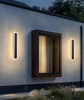 Modern Outdoor Wall Light With 15W LED Frosted White Acrylic Waterproof Sconce on house exterior at dusk