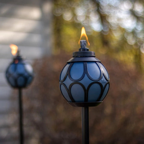 Two Pack Metal And Glass Globe Outdoor Torch Set For Patio And Yard Easy Install 64 Inch Tall Blue And Black With Wick And Snuffer in garden