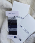 Super Handy Cashmere Darning Kit With 30 M Of High Grade Cashmere Thread In Six Colors displayed on white wool fabric.