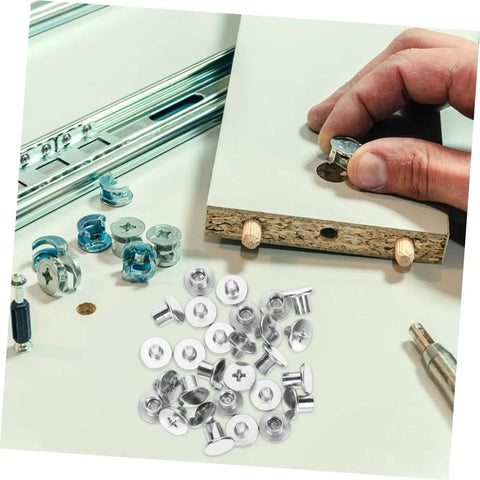 Built Tough Chicago Style Binding Screws For Books And Scrapbooks And Paper Crafts Using 75 Piece Silver Carbon Steel Fasteners on craft table.
