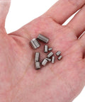 Close-up of Stainless Steel Set Screws Assortment Kit, 240-Piece, in a hand, showing various sizes with recessed end positioning.