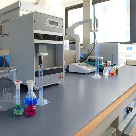 Gray Silicone Rubber Sheet 12 Inch Wide One Eighth Inch Thick 12 Inch Long High Temperature Resistant Mat on lab counter with equipment