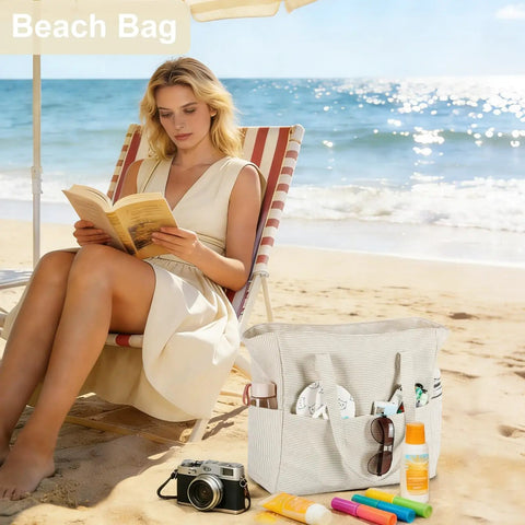 Woman reading on beach with Large 36L Waterproof Beach Tote Bag For Women With Zipper Wet Pocket Sandproof Lightweight Foldable Carryall Khaki White Stripes