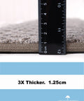 Close-up of Bayside Charm Dark Grey Carpet Stair Tread thickness measurement with ruler at 1.25 cm, shown from side angle.