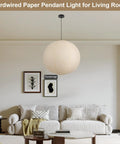 Large Off White Paper Pendant Light 23.6 Inch Japanese Rice Paper Ceiling Lamp With Cord And Canopy above cozy couch in living room.