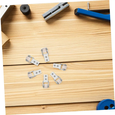 Six Piece Set Of One Inch White Nylon Sliding Roller Guide Wheels For Heavy Duty Furniture And Cabinet Drawer Tracks featuring smooth sliding guides on wooden surface.