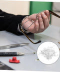 Man holding eyeglass frame, eyeglass frame gaskets and metal flat washers must have kit with 200 pcs replacement screws for rimless glasses quick repair and durable maintenance for long lasting eyewear life, tools on table.