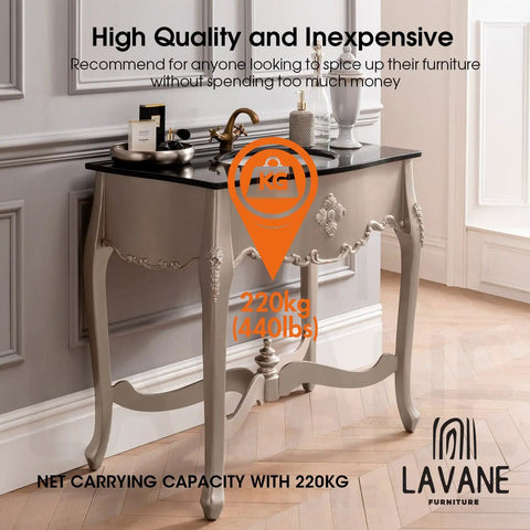 Elegant European-style wooden console table with carved legs, shown in a neutral-toned room with decorative items on top.
