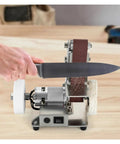 Compact Mini Electric Belt Sander in use, small durable build, polishing knife with dual sanding modes on a workbench.