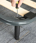 Adjustable Black Iron Furniture Support Legs Set for Beds, Cabinets, and Sofas attached with screws on a metal frame