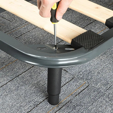 Adjustable Black Iron Furniture Support Legs Set for Beds, Cabinets, and Sofas attached with screws on a metal frame
