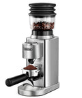 Premium Electric Coffee Grinder With Stainless Steel Conical Burrs And Forty Eight Adjustable Settings For Espresso To French Press Smooth Daily Grinding That Makes Your Morning Routine Hit Different For Home Baristas, showcasing ground coffee in portafilter.