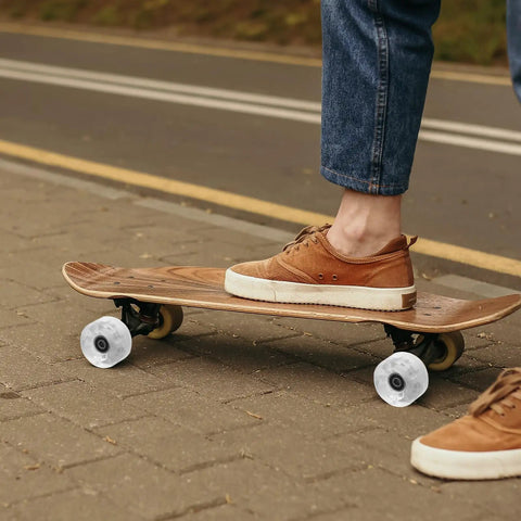 Person skating on road with Light Up Roller Skate Wheel Set For Outdoor Indoor Inline Skates And Quad Skates Replacement PU Wheel With LED