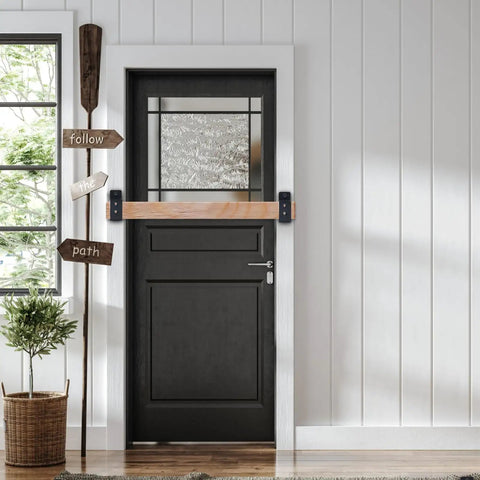 Top Shelf Heavy Duty Door Barricade Brackets For Total Security mounted on a black door, U-shaped design in a stylish home setting.