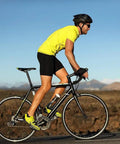 Cyclist on road bike illustrating use of Sixteen Pack Bike Shifter Cables 1.9 Meter Stainless Steel Replacement Set for smooth shifting